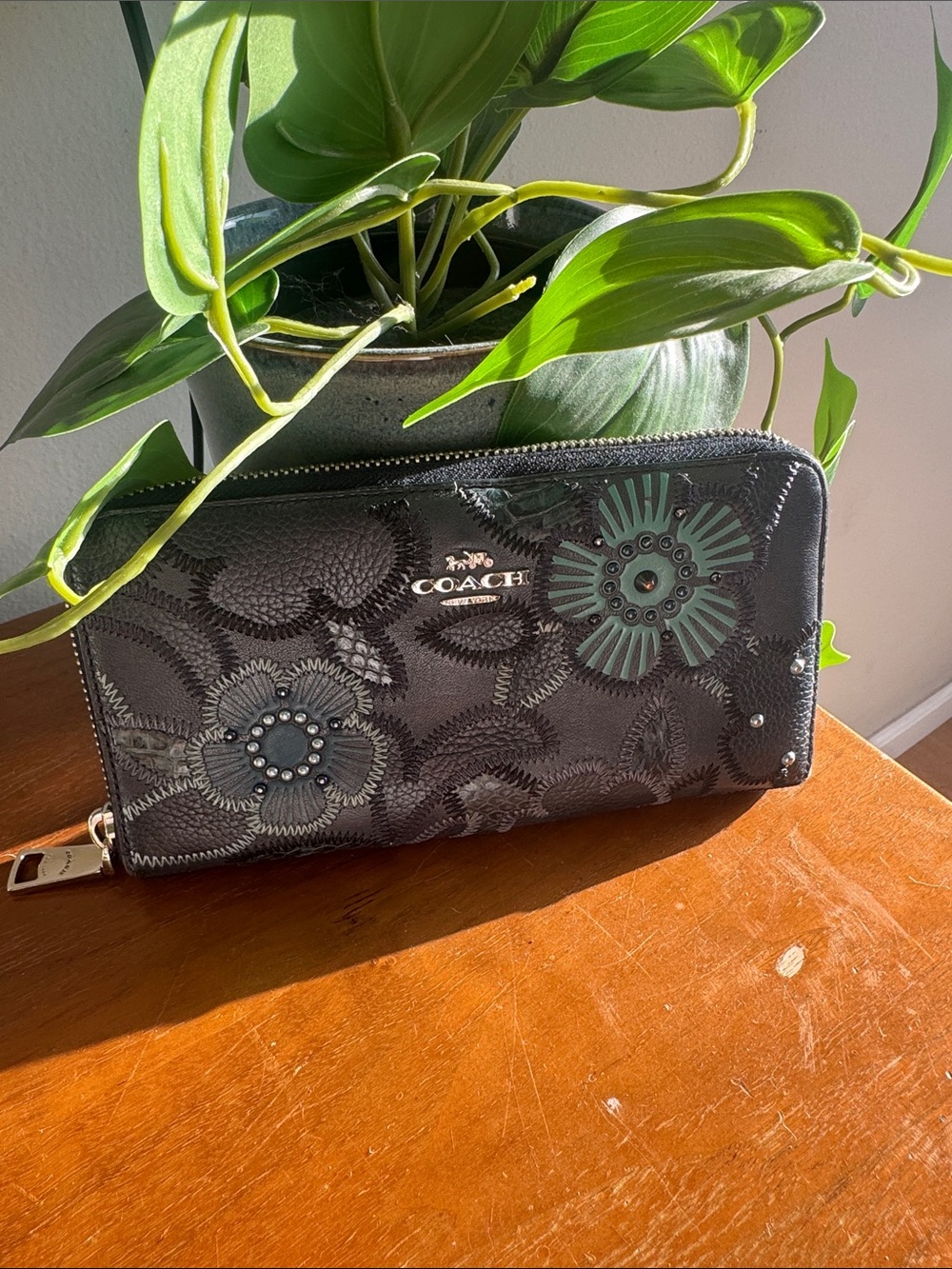 COACH Black Wallet with Green Floral Appliqués
